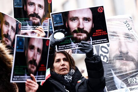 The aid worker, Olivier Vandecasteele, had been sentenced to 40 years in prison for spying. The former diplomat was convicted of plotting a 2018 bomb attack.