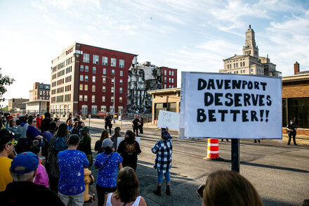 Residents of Davenport, Iowa, protested plans to quickly remove the damaged building. Rescue workers pulled one resident to safety hours after officials said they were unaware of anyone still trapped.