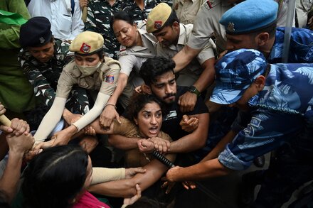 Their protest dispersed, female wrestlers who have accused a powerful official of sexual harassment went to the Ganges intending to throw away their Olympic medals.
