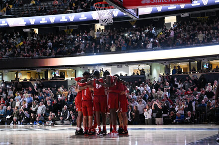 A freshman player sued The Times after it placed him at a crime scene. The newspaper will correct its coverage.