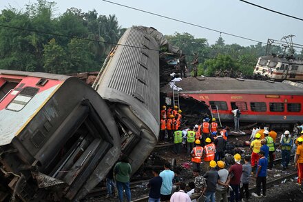 Rescuers searched for victims at the crash site, where two passenger trains and a freight train were involved in what a government report called a “three-way accident.”