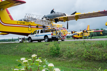 A system that normally relies on sharing people and aircraft between province is under stress as fires spread across Canada.